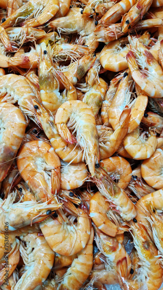 Frozen boiled shrimp in a supermarket or grocery store, close-up. Seafood Frozen boiled shrimp in a supermarket or grocery store, close-up. Seafood