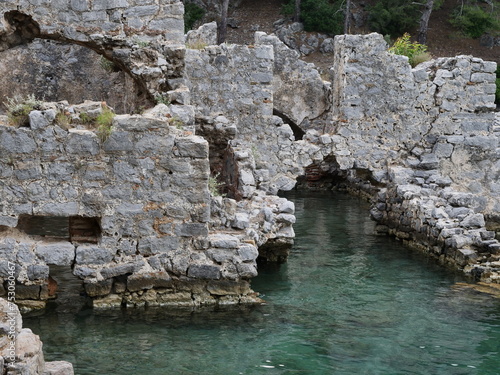 ancient roman bath in the sea historical building mediterranean coast turkey gocek fethiye photo