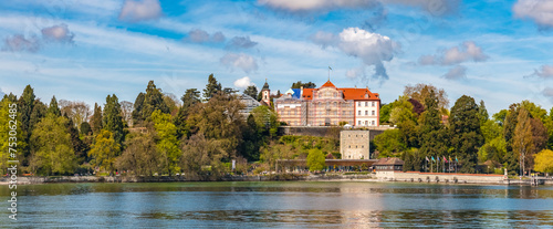 Huge panorama of the east side of the famous island Mainau in Lake Constance (Bodensee), Germany. Above the medieval Comturey tower and the small harbour are the Teutonic castle with the palm house.