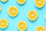 Summer pattern made with yellow lemon slice on bright light blue background. Minimal summer concept.