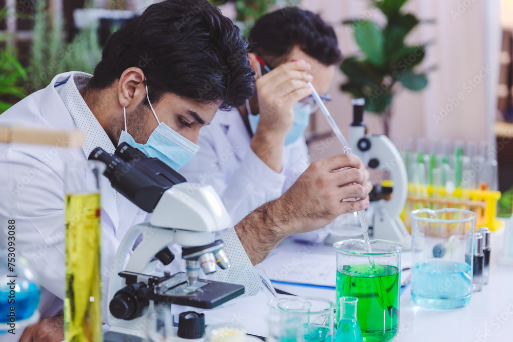 Scientist and people in science exam, test or group project in experiment or assignment at laboratory. Scientist or pharmacist work in scientific lab. Medical Development Laboratory. Scientist and people in science exam, test or group project in experiment or assignment at laboratory. Scientist or pharmacist work in scientific lab. Medical Development Laboratory.