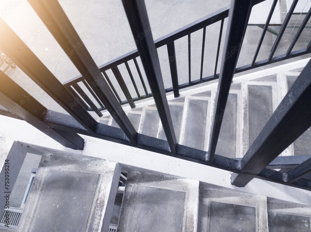 Obraz premium Interior of the stairs leading to the top floor in an industrial office building.