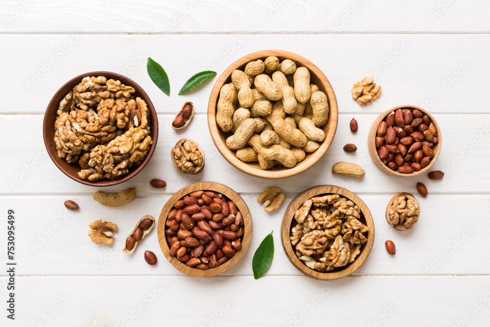 Walnut kernel halves, in a wooden bowl. Close-up, from above on colored background. Healthy eating Walnut concept. Super foods with copy space Walnut kernel halves, in a wooden bowl. Close-up, from above on colored background. Healthy eating Walnut concept. Super foods with copy space