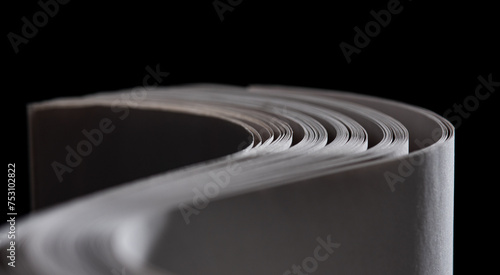 Quadro su tela sheets white paper edge flow wave shape on black copy space empty background