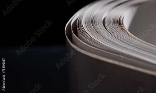 фотографія sheets white paper edge flow wave shape on black copy space empty background