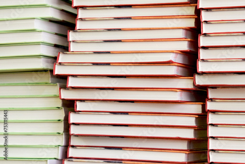 Load of knowledge. A large pile of new books in hardcover