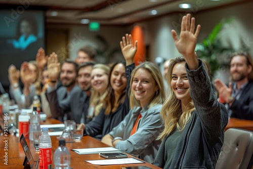 A motivated group of business professionals raising their hands in agreement or volunteering