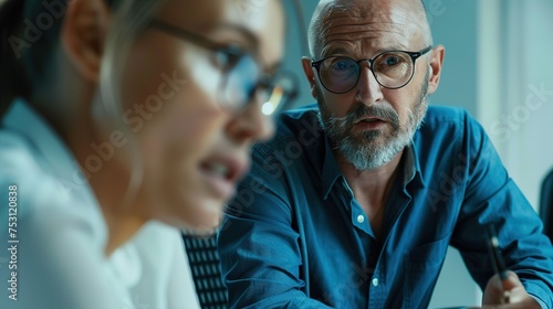 A focused close-up of office staff colleagues attentively discussing a new project with the boss, real photo, stock photography ai generative high quality image