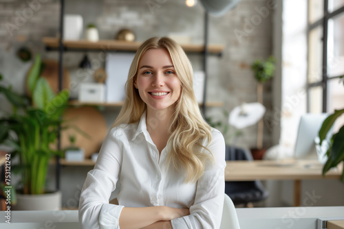 Portrait of smiling young businesswoman seated, Happy female employee, professional confident woman at modern office, Smiling business woman wallpaper concept, female Portrait at co-working space