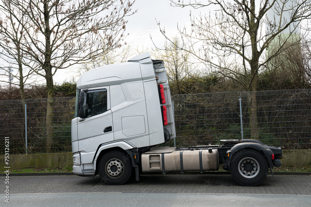 Gray car semi-trailer stands on the side of the road. Side view. Gray car semi-trailer stands on the side of the road. Side view.