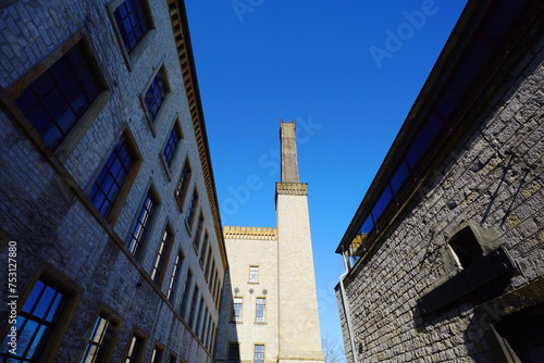 Ravensberger Spinnerei Kulturzentrum in Bielefeld. Fabrikschloss mit strahlendblauen Himmel photo