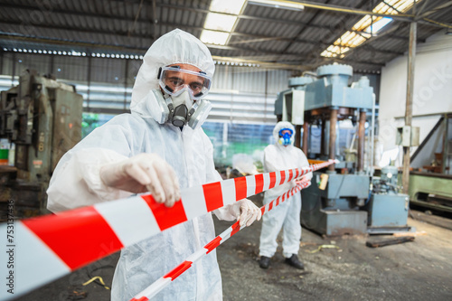 chemical specialist wear safety uniform and gas mask inspecting chemical leak in industry factory