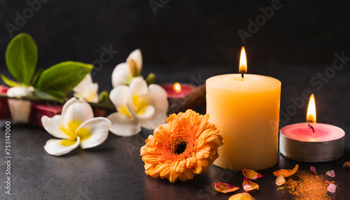 Beautiful composition with flowers and burning candles. Aromatherapy and relax in spa and home