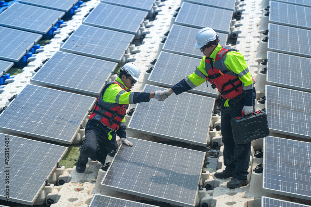 custom made wallpaper toronto digitalPhotovoltaic engineers work on floating photovoltaics. workers Inspect and repair the solar panel equipment floating on water. Engineer working setup Floating solar panels Platform system on the lake.