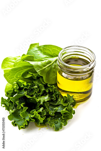 A glass jar of homemade salad dressing next to fresh greens, isolated on a white background, to promote homemade over store-bought