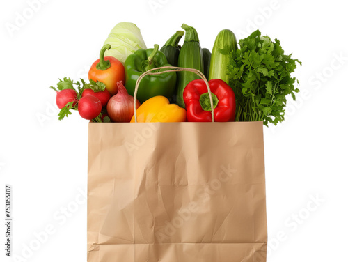 Brown paper shopping bag full of healthy vegetables as a onion, green, red pepper and zucchini.