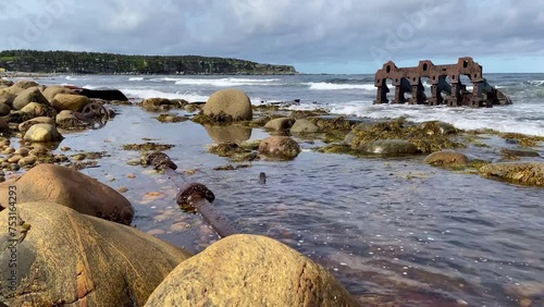 Wreck of the S.S. Ethie at Martin's Point is in Gros Morne National Park on The Viking Trail in Newfoundland, Canada. Rusty debris from 1919 shipwreck along a rocky shore.