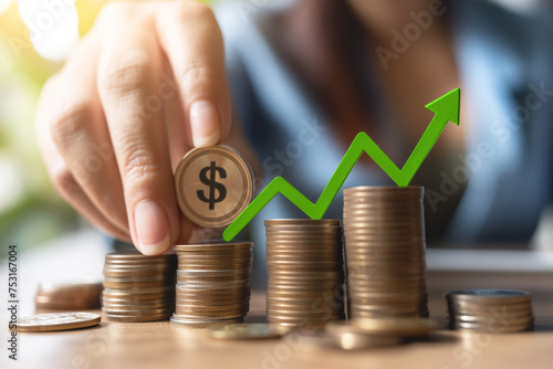 A woman counts coins in stacks with a dollar sign. Above them is a green arrow showing increase. The concept of increase in profits, rate, dividends, interest. Saving money for the future. Finance, in