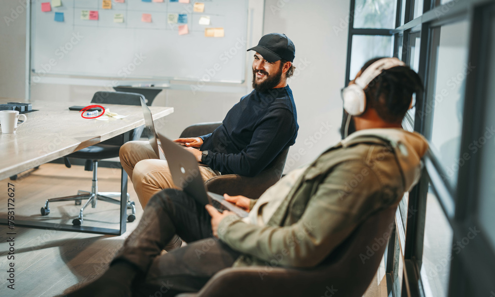 Successful collaboration: Two programmers working together in a professional office Successful collaboration: Two programmers working together in a professional office