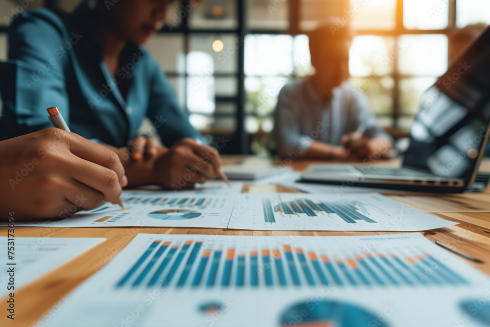 professionals analyzing financial data, with graphs and statistics visible, in a busy office setting professionals analyzing financial data, with graphs and statistics visible, in a busy office setting