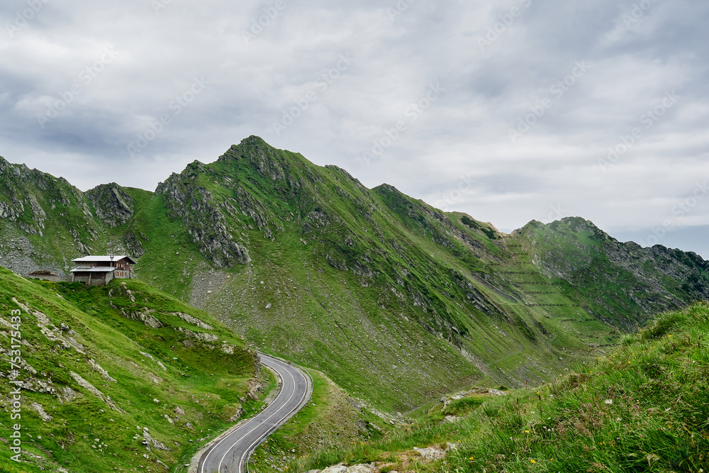 Transfagarasan through the Fagaras Mountains with green vegetation Transfagarasan through the Fagaras Mountains with green vegetation