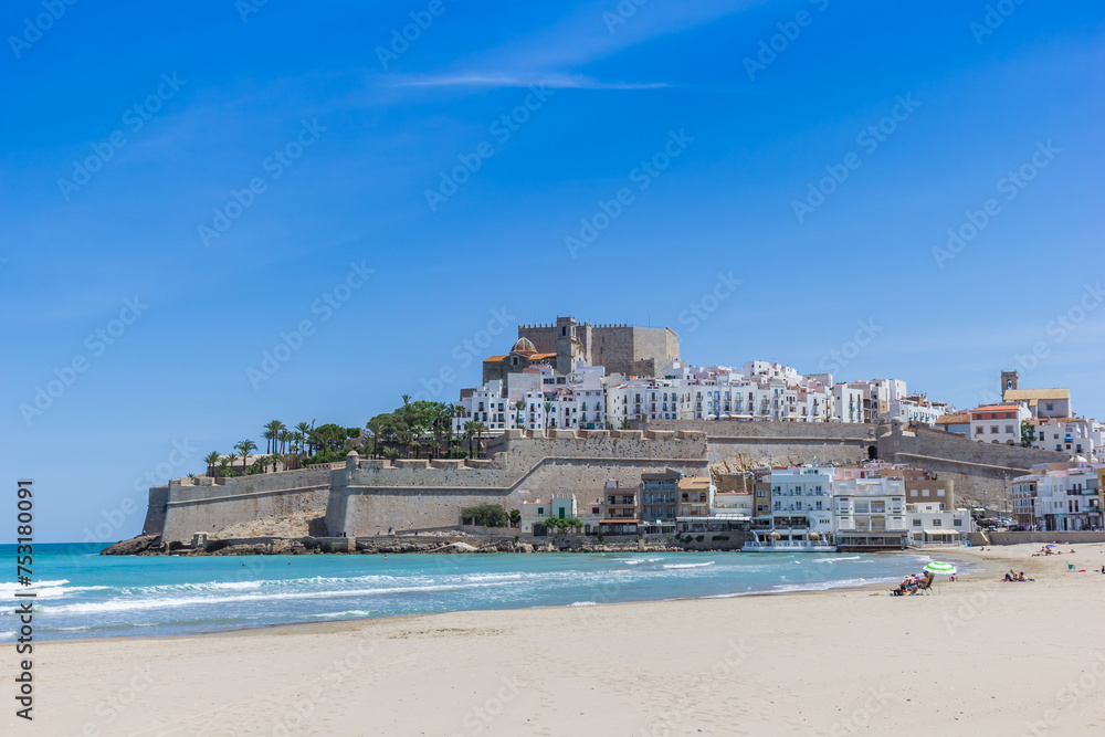 Beach in front of the historic town of Peniscola, Spain