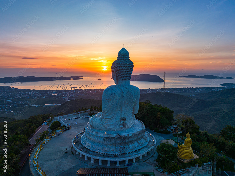 aerial view amazing colorful sky at sunrise in front of Phuket big Buddha..The sun's rays illuminate the Buddha's serene making it .stand out against the backdrop of sky and creating a stunning image