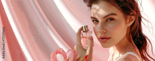 Wallpaper Mural beautiful young girl with a bottle of perfume in her hands on a pink background. advertising poster or banner. space for text Torontodigital.ca