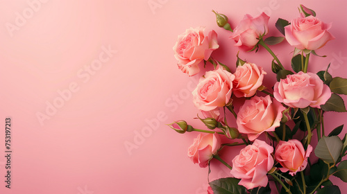 A bouquet of rose flowers placed beside a pink background, copy space © TANBIR