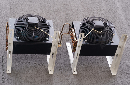 Twin Antminer Cooling Units on Textured Surface photo