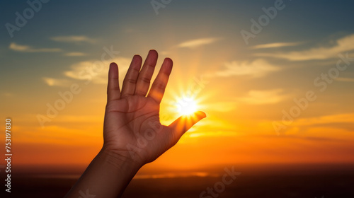 hands holding the sun at dawn.