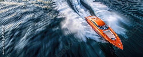 Aerial angle capturing a speedboat racing water patterns trailing showcasing velocity and freedom photo