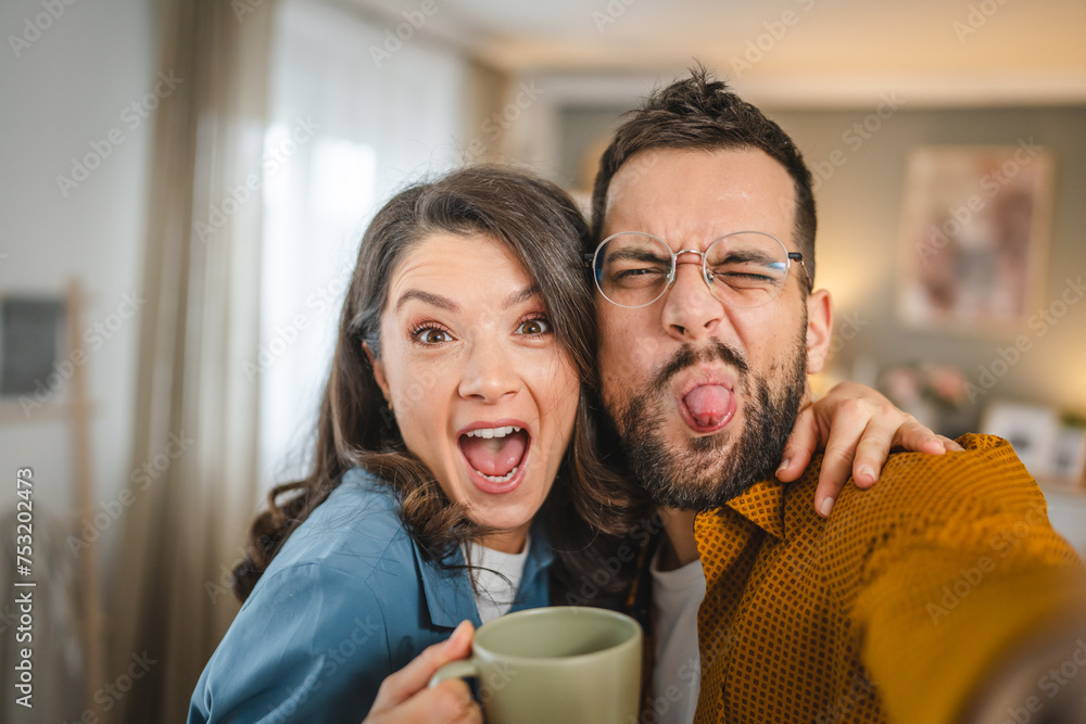 self portrait selfie of happy couple husband and wife at home self portrait selfie of happy couple husband and wife at home