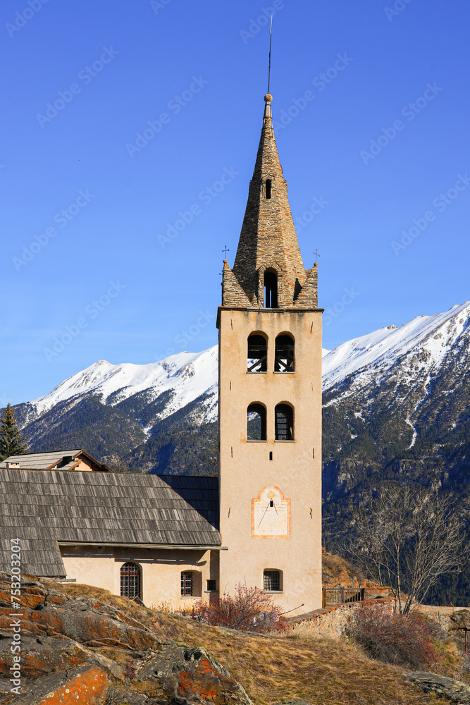 Bell tower of the church of Saint Peter in Puy-Saint-Pierre, a hillside Alpine village located above Briançon in the Hautes Alpes department of the French Alps, France