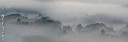 Morning fog in the black forest mountains, a foggy natural woods landscape. Panorama of Neckar valley in germany. 