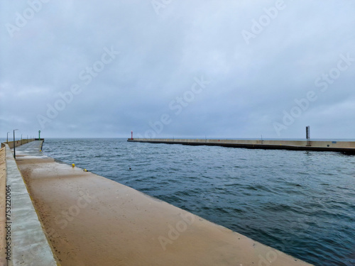Dziwna strait with beacon on the port in Dziwnow town on the Baltic Sea coast. Poland photo