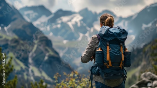 Woman Hiking Up Mountain With Backpack