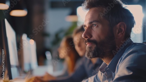 Man Sitting in Front of Computer Monitor