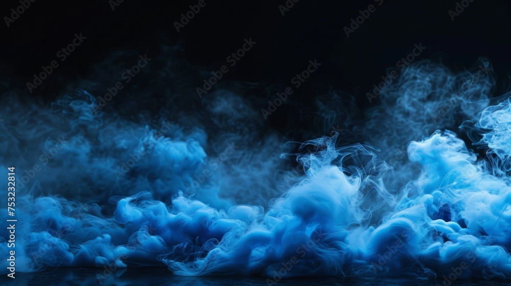 Blue smoke on the floor on a black background. Clouds of fog are located on the ground. Empty wall. Abstract wallpaper for theater and concert design.