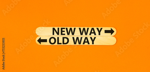 New or old way symbol. Concept word New way Old way on beautiful wooden stick. Beautiful orange table orange background. Business and new or old way concept. Copy space.