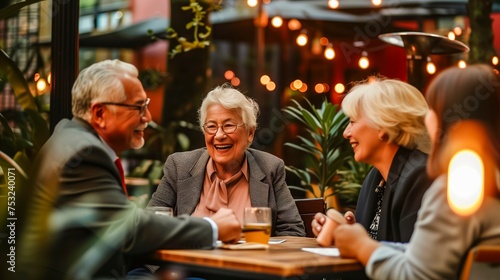 Joyful Elderly Trio Engaging In Lively Conversation At Cozy Outdoor Cafe Illuminated By Warm Lights.