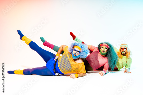Obraz na płótnie Happy drag queens lying on floor in studio