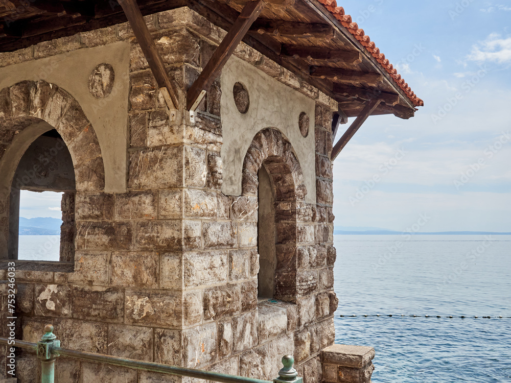 Stone lookout structure in Lungomare, a coastal promenade called Franz Joseph I Promenade. It connects Volosko with Opatija. Istria, Croatia, Europe