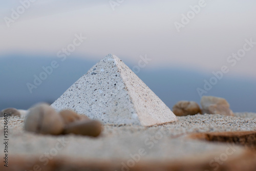 pyramid and blurred mountains, 