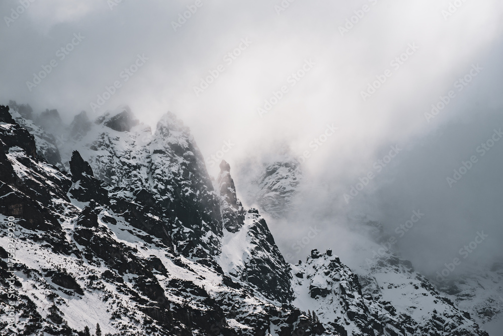 Mountain peaks near Morskie Oko Lake in Poland at Winter. Tatras range - obrazy, fototapety, plakaty 