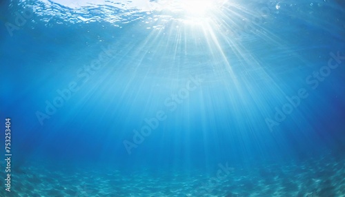 Underwater background with blue water and sun rays