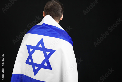 Young Jewish man with flag ...