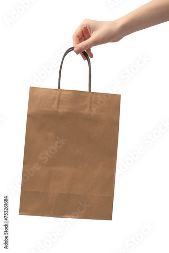 Paper bag in woman hand isolated on a white background.