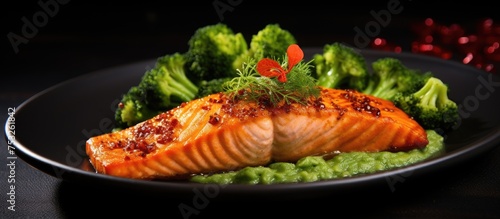Gourmet Salmon Dish Served with Colorful Roasted Vegetables and Zesty Lemon Sauce
