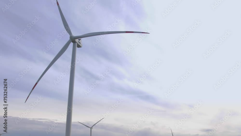 several wind turbines are in the field and generate electricity several wind turbines are in the field and generate electricity
